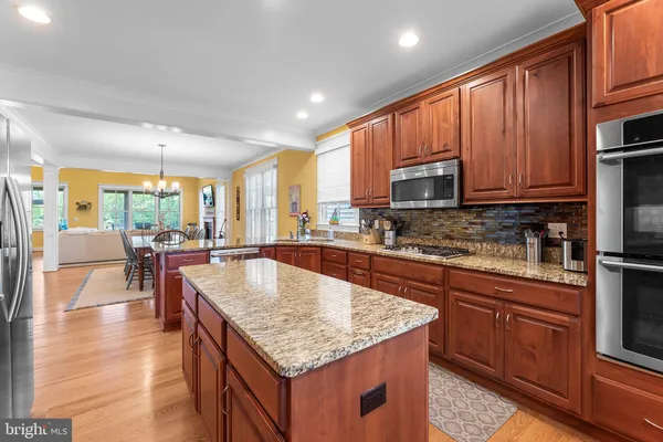 a spacious bedroom with a bed and a chair