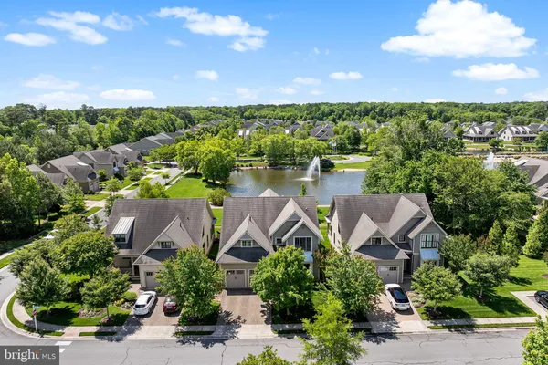 a balcony with furniture and a potted plant