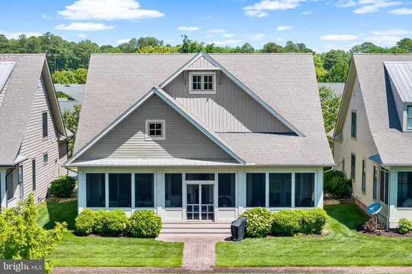 a living room with furniture fireplace and window