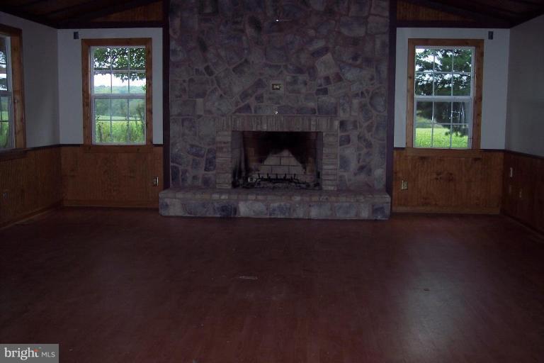 425 Bucher John Road Union Bridge, MD 21791 - Photo 2 of 6 a living room with a fireplace