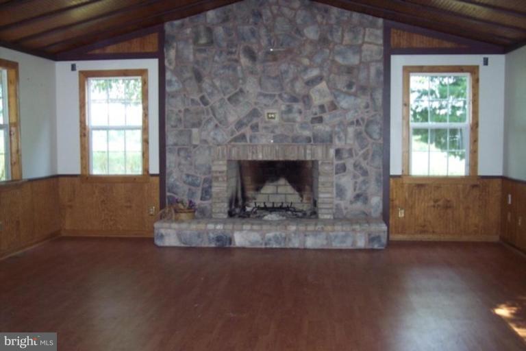 425 Bucher John Road Union Bridge, MD 21791 - Photo 6 of 6 a living room with furniture and a fireplace