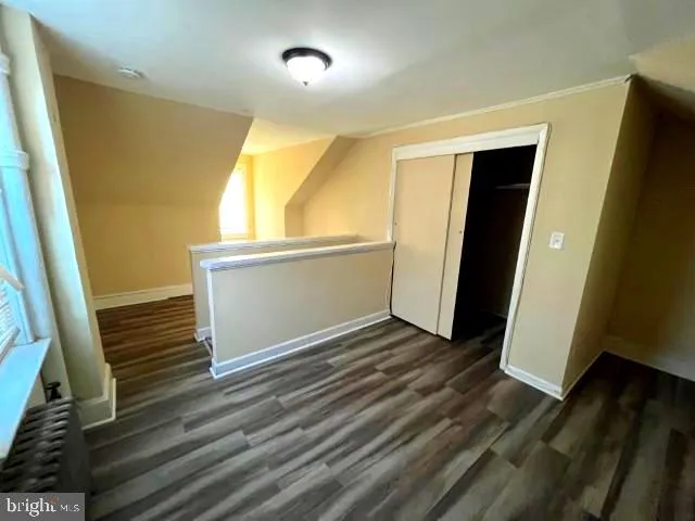 a bathroom with a shower and a sink