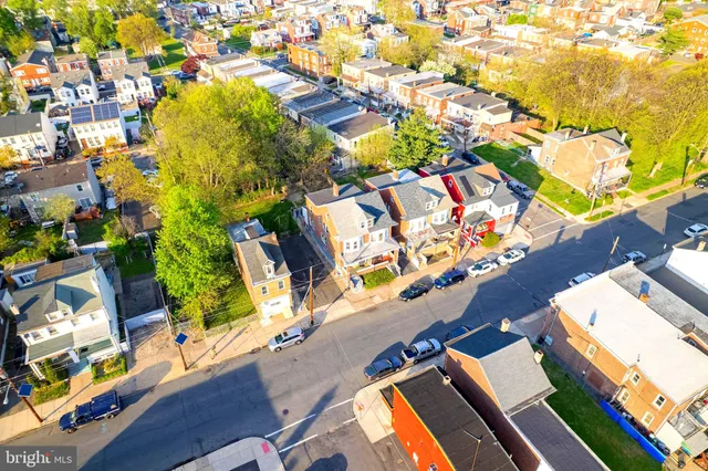 an aerial view of a residential apartment building with swimming pool