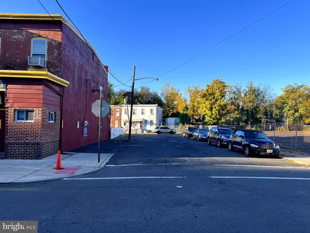 a view of street with parked cars