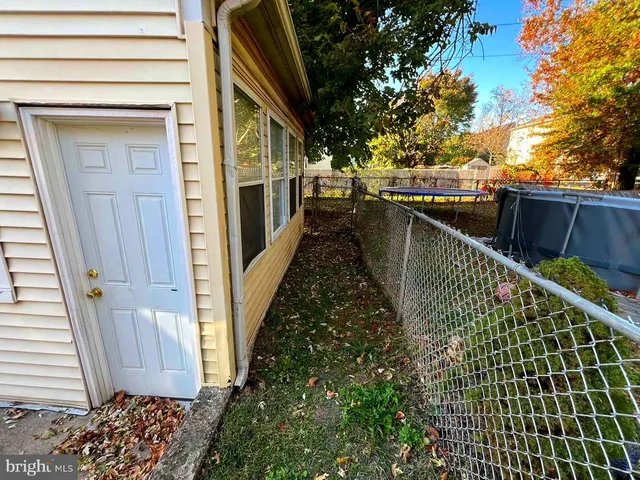 a view of balcony with wooden floor and fence