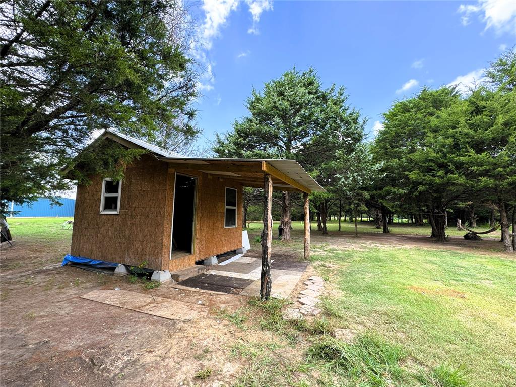 2087 Meadow Road Kerens, TX 75144 - Photo 20 of 28 a backyard of a house with entertaining space