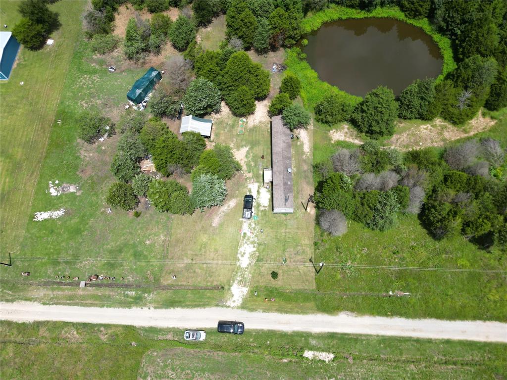2087 Meadow Road Kerens, TX 75144 - Photo 25 of 28 an aerial view of a residential houses with yard