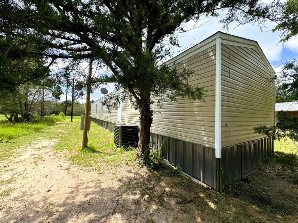 2087 Meadow Road Kerens, TX 75144 - Photo 4 of 28 a view of a house with a yard