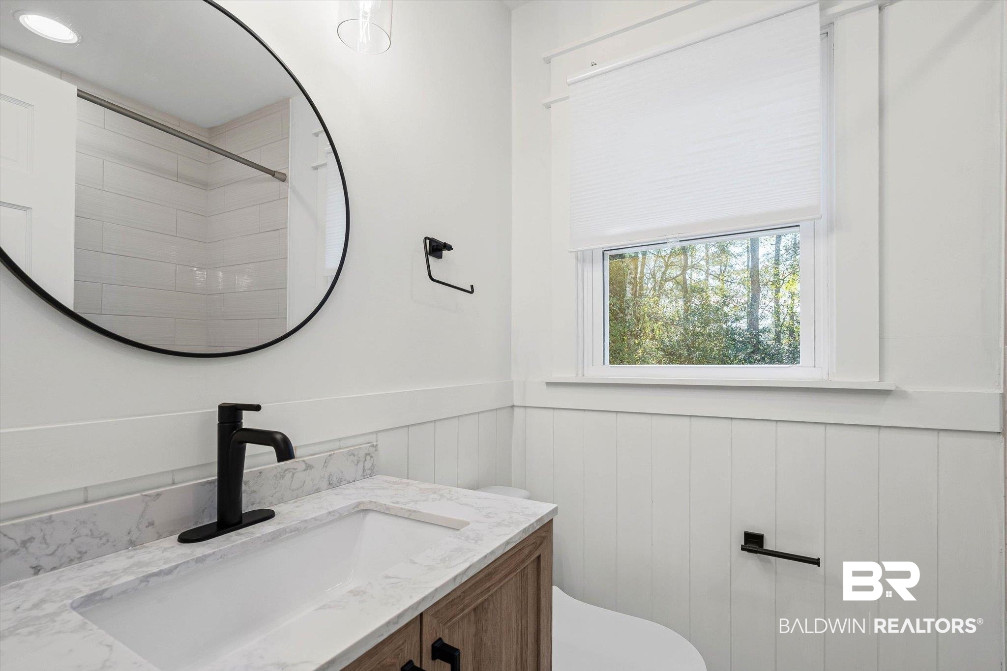 3933 Radnor Avenue Mobile, AL 36608 - Photo 23 of 36 Upstairs shared Bathroom featuring a wainscoted wall, vanity, and a shower