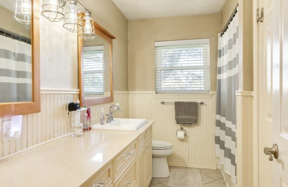 820 Perry Street Angleton, TX 77515 - Photo 26 of 26 a bathroom with a sink toilet and shower