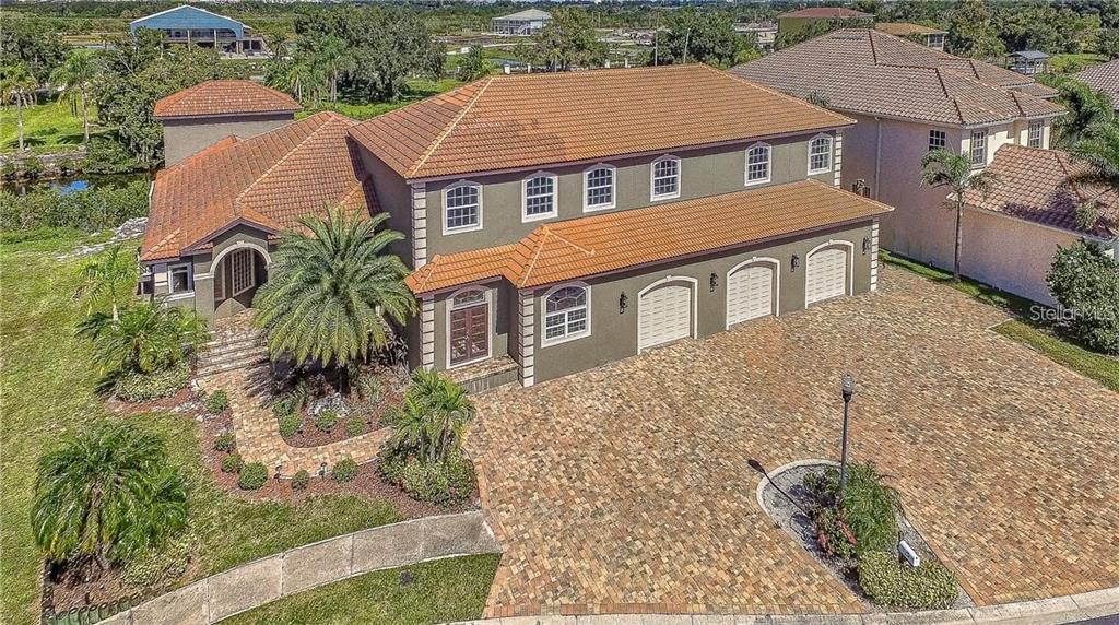 531 Treviso Drive Apollo Beach, FL 33572 - Photo 1 of 1 an aerial view of a house with a yard