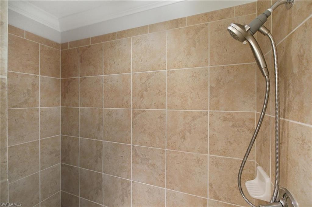 9844 Venezia Circle, Unit 714 Naples, FL 34113 - Photo 30 of 50 a bathroom with a shower