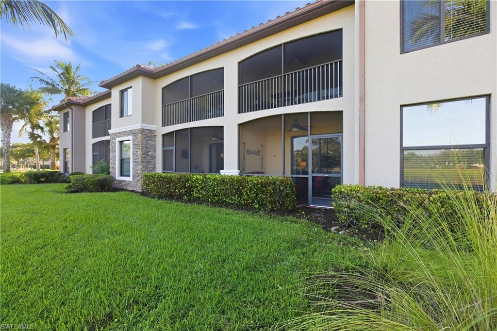 9844 Venezia Circle, Unit 714 Naples, FL 34113 - Photo 39 of 50 a house with garden in front of it