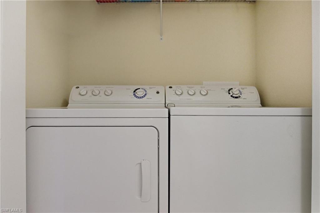 9844 Venezia Circle, Unit 714 Naples, FL 34113 - Photo 40 of 50 a utility room with dryer and washer
