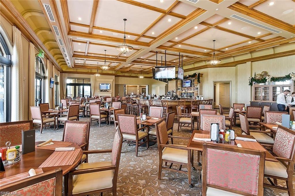 9844 Venezia Circle, Unit 714 Naples, FL 34113 - Photo 45 of 50 a living room with lots of furniture and clutter