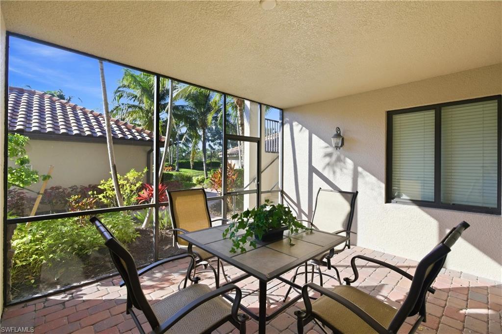 9844 Venezia Circle, Unit 714 Naples, FL 34113 - Photo 6 of 50 a view of a chairs and table in patio