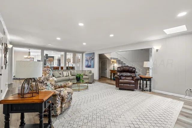a living room with furniture and a table