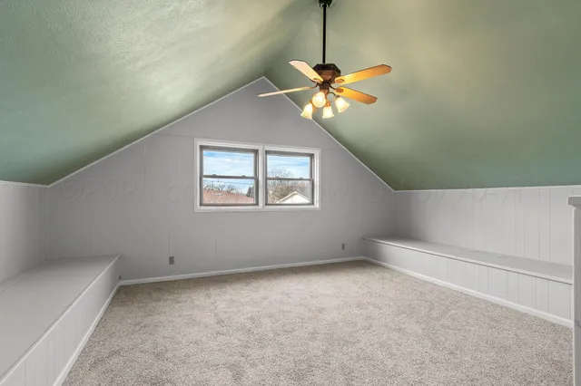 a view of a ceiling fan and a chandelier fan