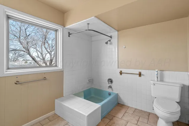 a bedroom with furniture and a chandelier