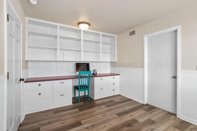 a room with a desk and chair