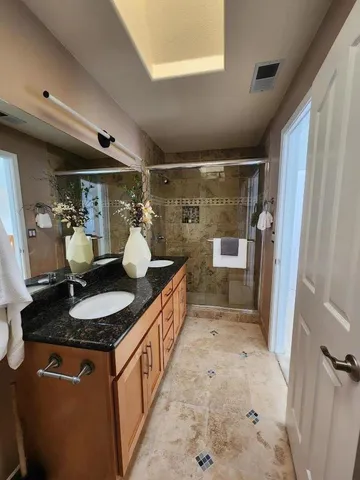 a bathroom with sink and mirror