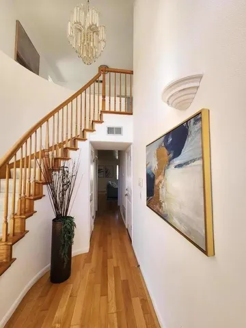 a view of entryway with wooden floor