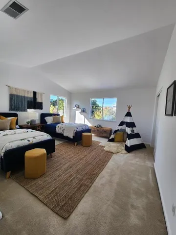 a living room with furniture and a lamp