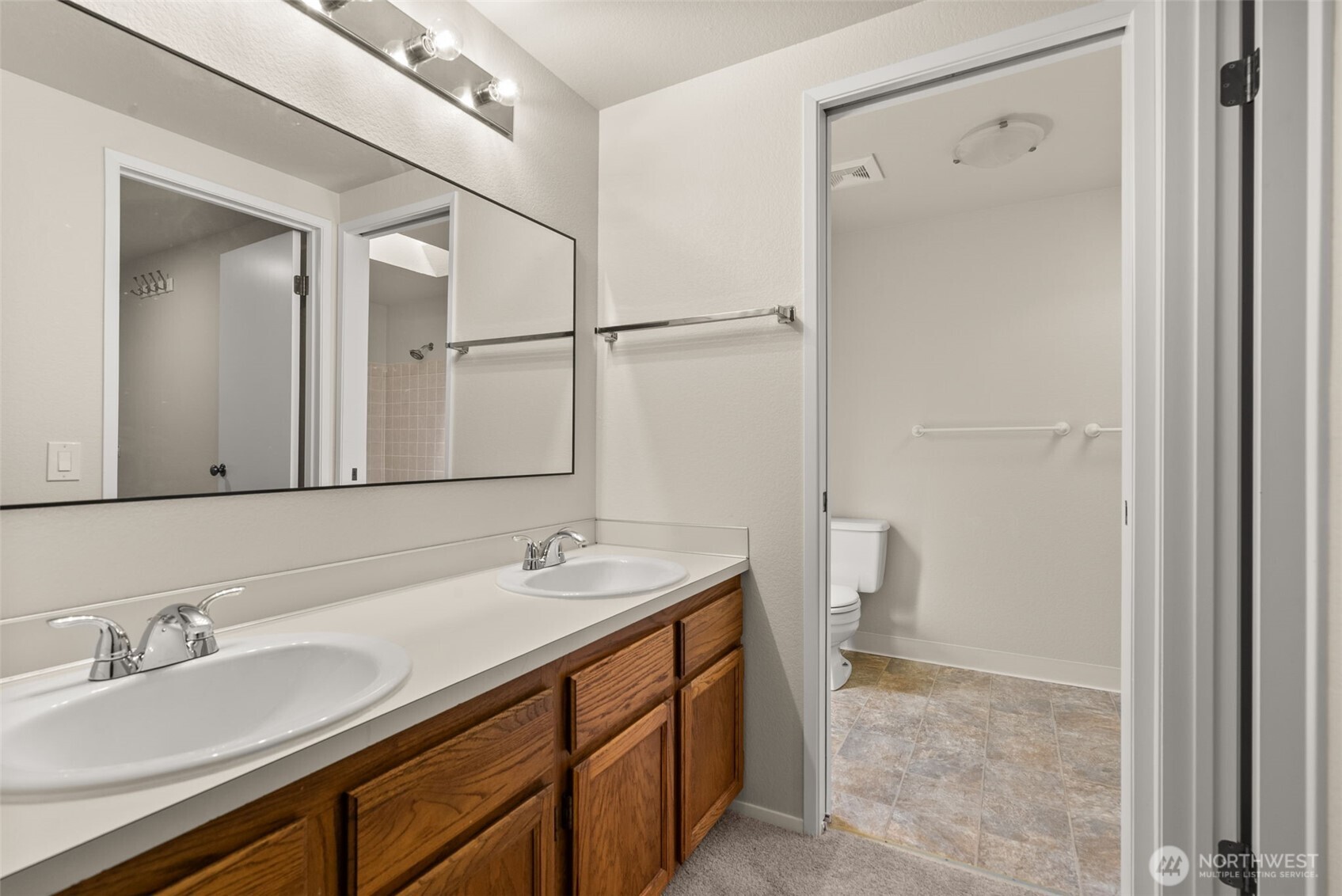 13603 Southeast 239th Street Kent, WA 98042 - Photo 11 of 23 a bathroom with a sink and a mirror