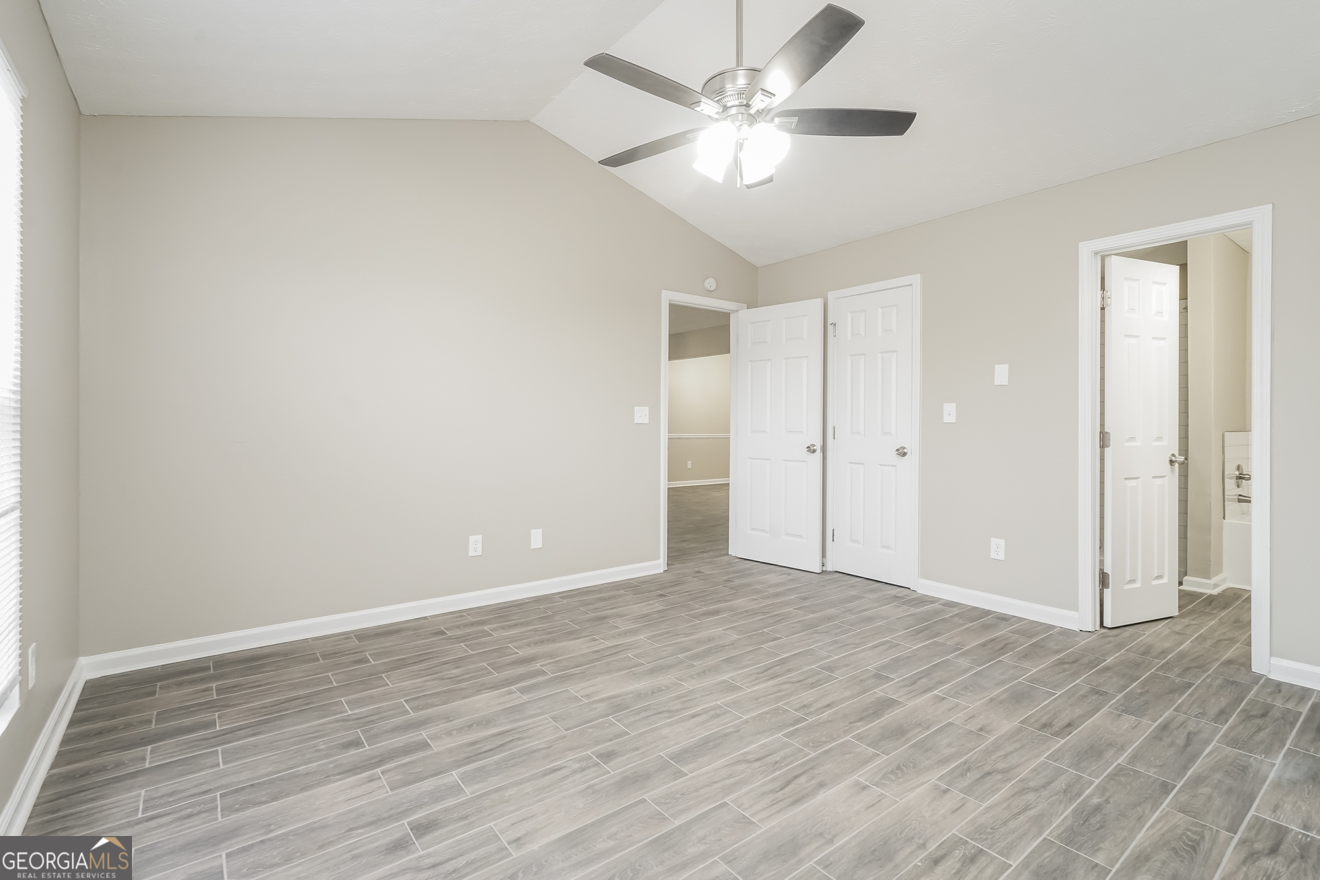 145 Fairclift Drive Covington, GA 30016 - Photo 8 of 16 a view of an empty room with wooden floor