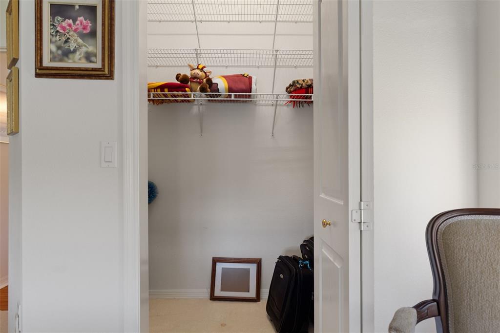 10081 Georgetown Court Weeki Wachee, FL 34613 - Photo 43 of 76 a view of walk in closet with clothes and shoes