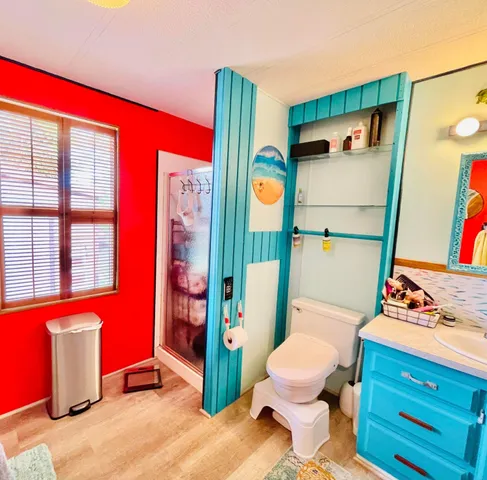 a bathroom with a toilet tub and shower