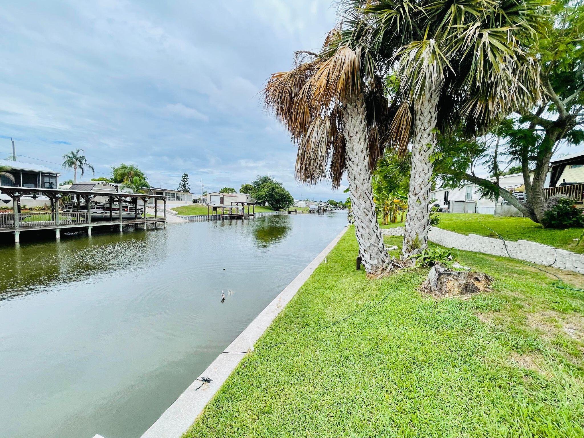 2301 Southeast 33rd Street Okeechobee, FL 34974 - Photo 26 of 31 a view of a lake with houses in the back