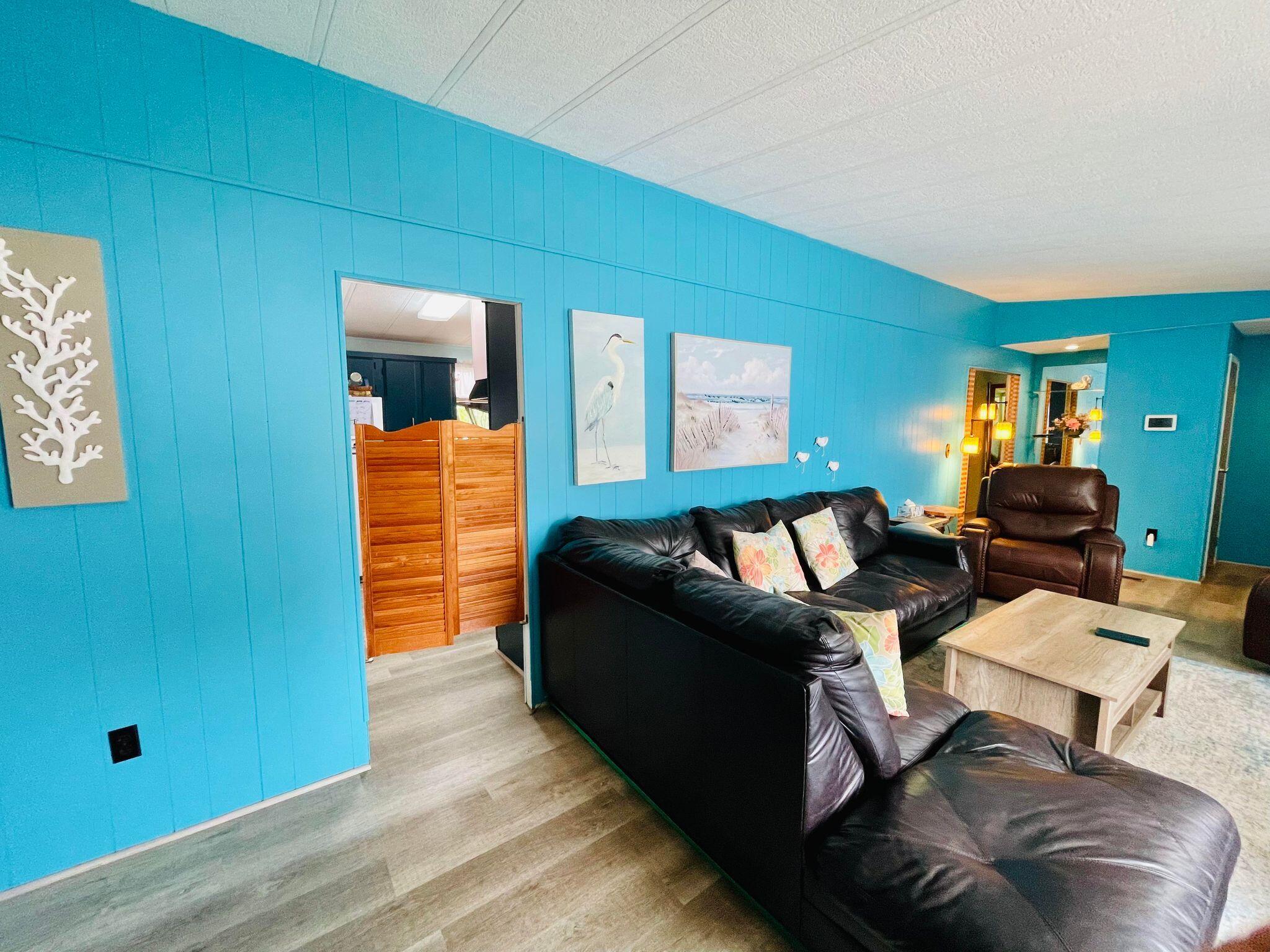 2301 Southeast 33rd Street Okeechobee, FL 34974 - Photo 8 of 31 a living room with furniture and a window