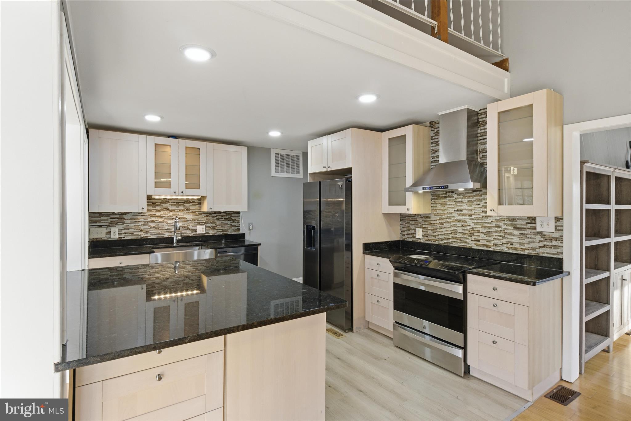 5515 Westcliff Court Burke, VA 22015 - Photo 11 of 47 a kitchen with stainless steel appliances granite countertop a stove and a refrigerator