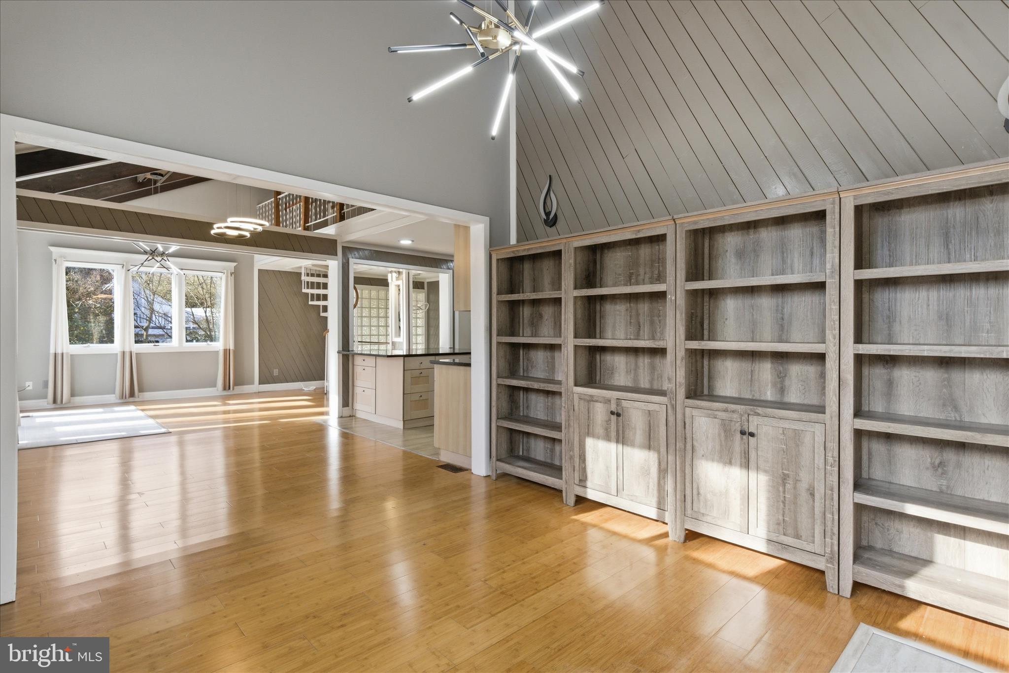 5515 Westcliff Court Burke, VA 22015 - Photo 16 of 47 a view of an empty room with a window and wooden floor
