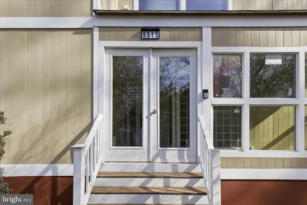 a front view of a house with a porch