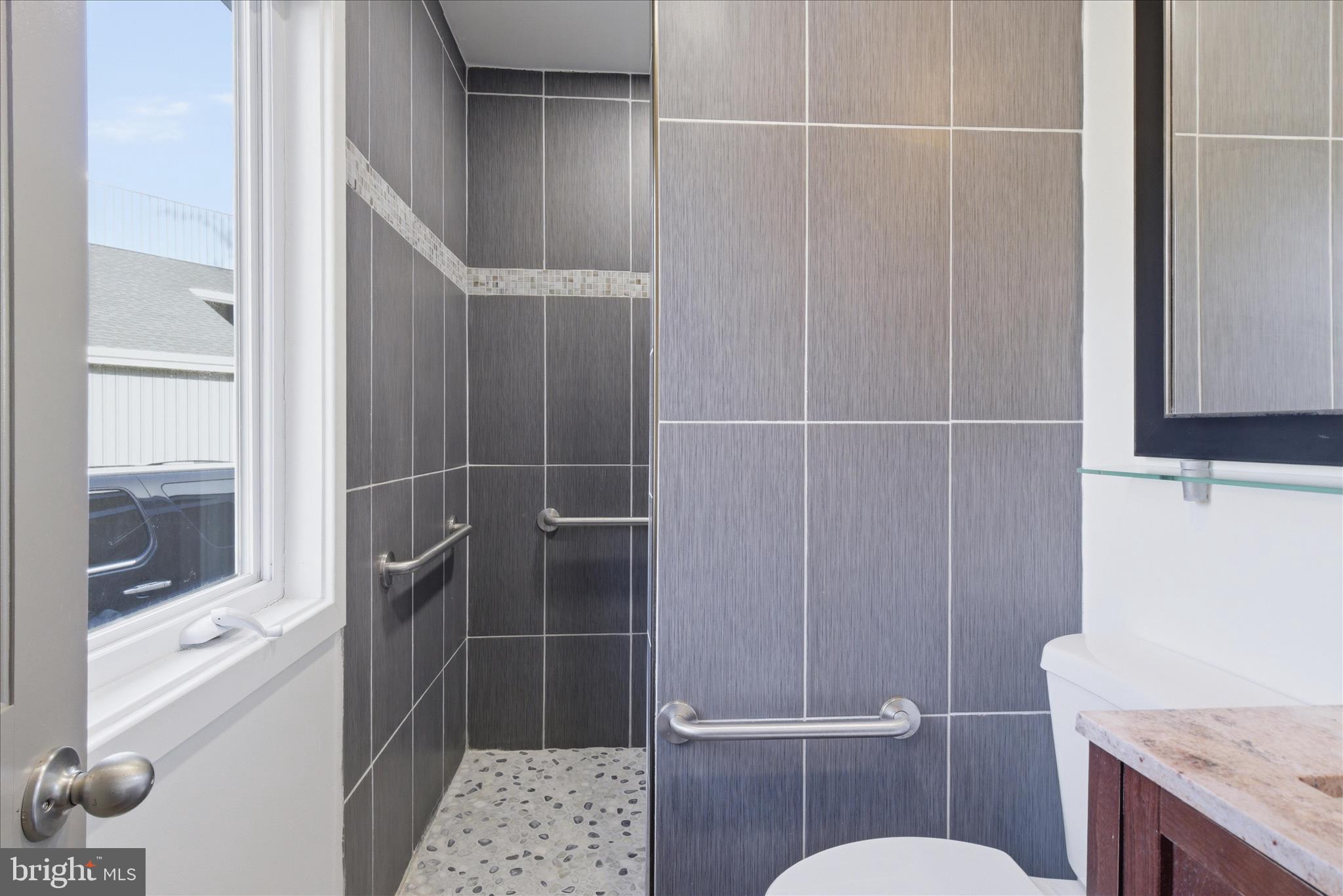 5515 Westcliff Court Burke, VA 22015 - Photo 21 of 47 a bathroom with a sink toilet and shower
