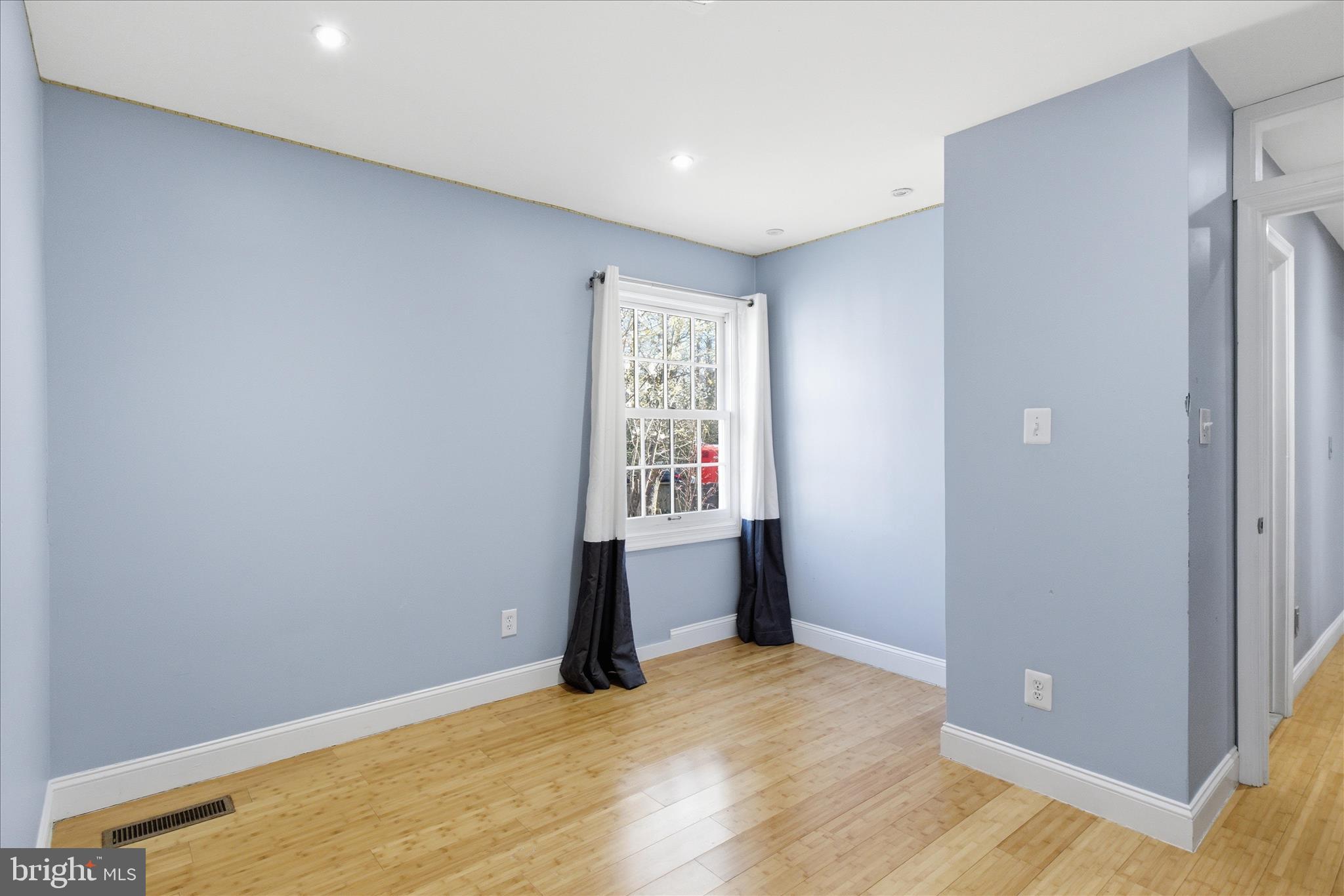 5515 Westcliff Court Burke, VA 22015 - Photo 25 of 47 a view of an empty room with wooden floor and a window