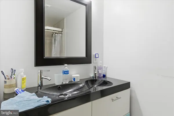 a spacious bedroom with a bed and a desk