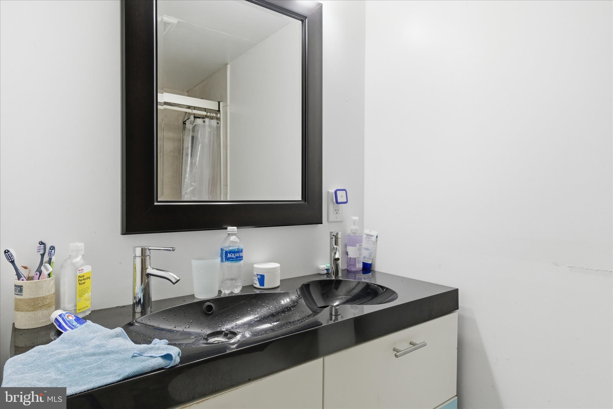 5515 Westcliff Court Burke, VA 22015 - Photo 30 of 47 a bathroom with a granite countertop sink and a mirror