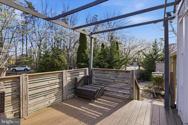 a view of a patio with table and chairs under an umbrella