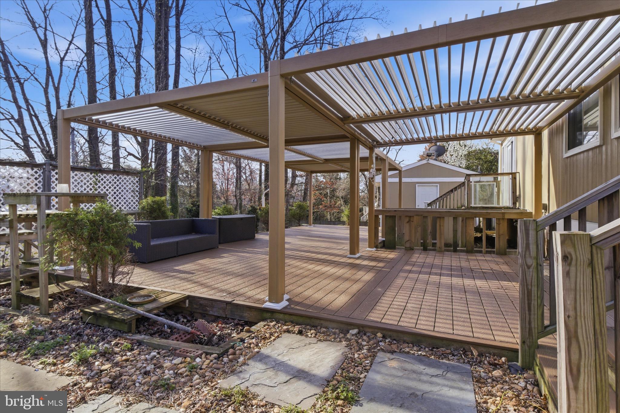 5515 Westcliff Court Burke, VA 22015 - Photo 39 of 47 a view of a patio with table and chairs under an umbrella