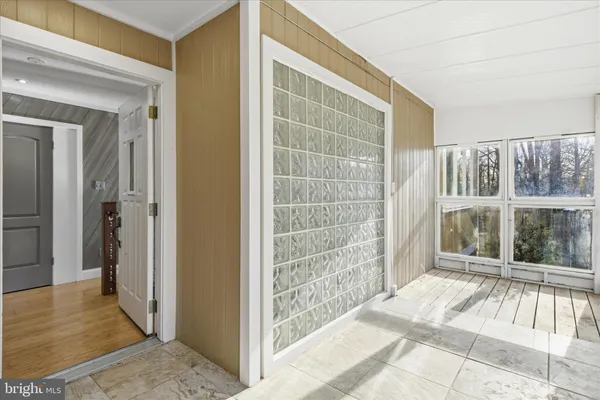 a view of a room with entrance door