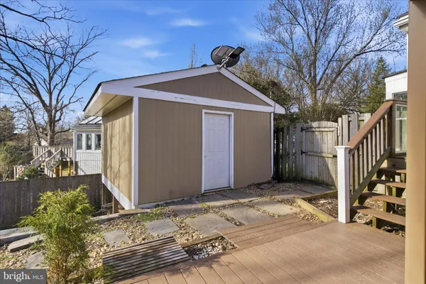 a view of a backyard with large trees