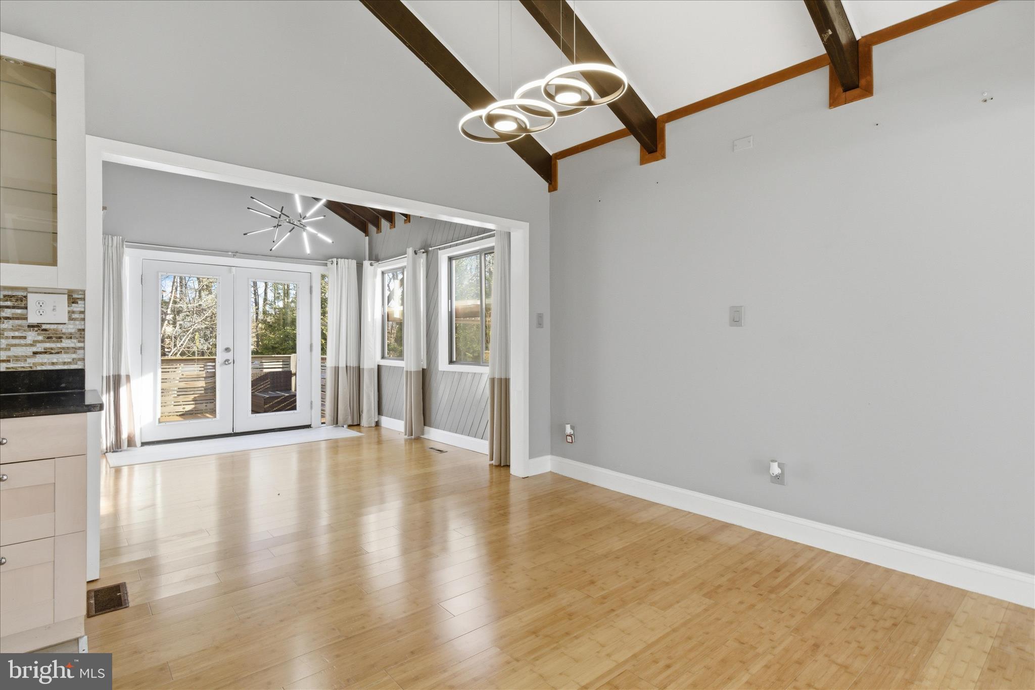 5515 Westcliff Court Burke, VA 22015 - Photo 6 of 47 a view of an empty room with a window and wooden floor