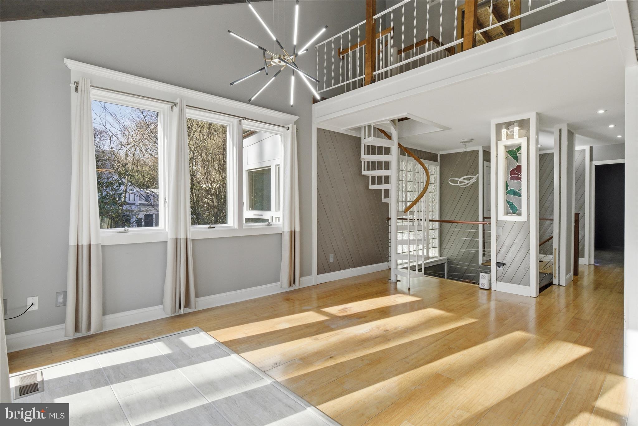 5515 Westcliff Court Burke, VA 22015 - Photo 8 of 47 a view of a hallway with wooden floor and a fireplace
