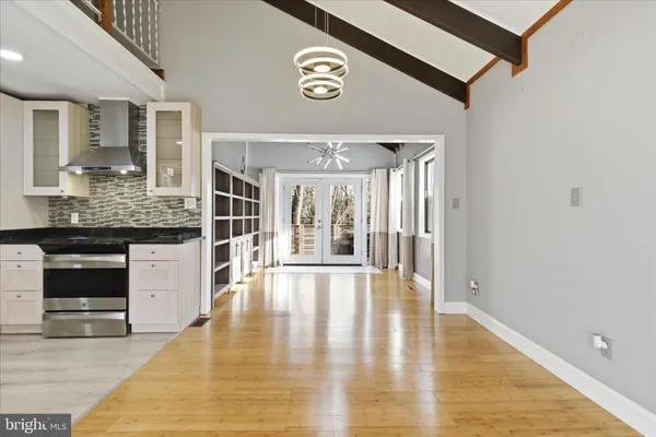 a view of an entryway with wooden floor