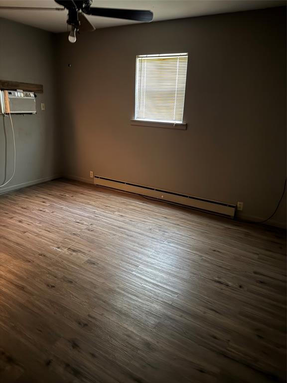 407 West 12th Street Quanah, TX 79252 - Photo 10 of 11 a view of an empty room with a window