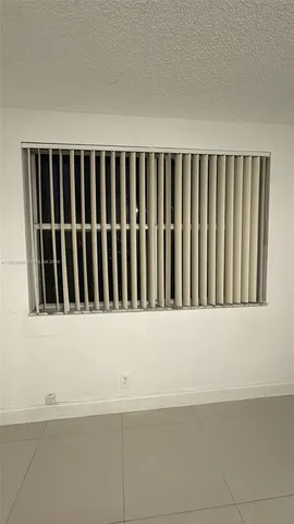 a swimming pool with outdoor seating and yard