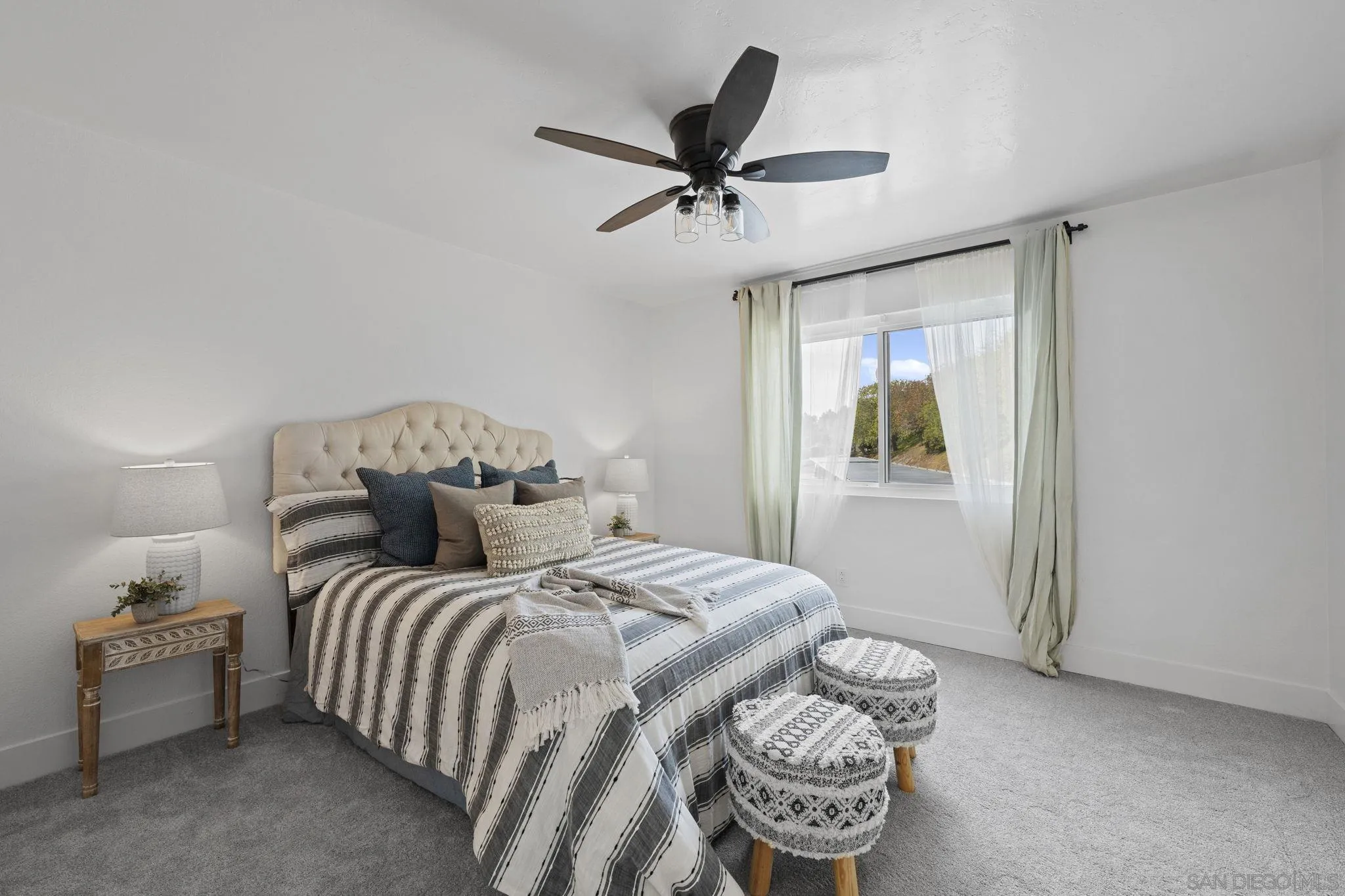3002 Blue Oak Court Spring Valley, CA 91978 - Photo 11 of 23 a bedroom with a bed and a chandelier